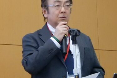 イベントの意義を説明する田中副会長