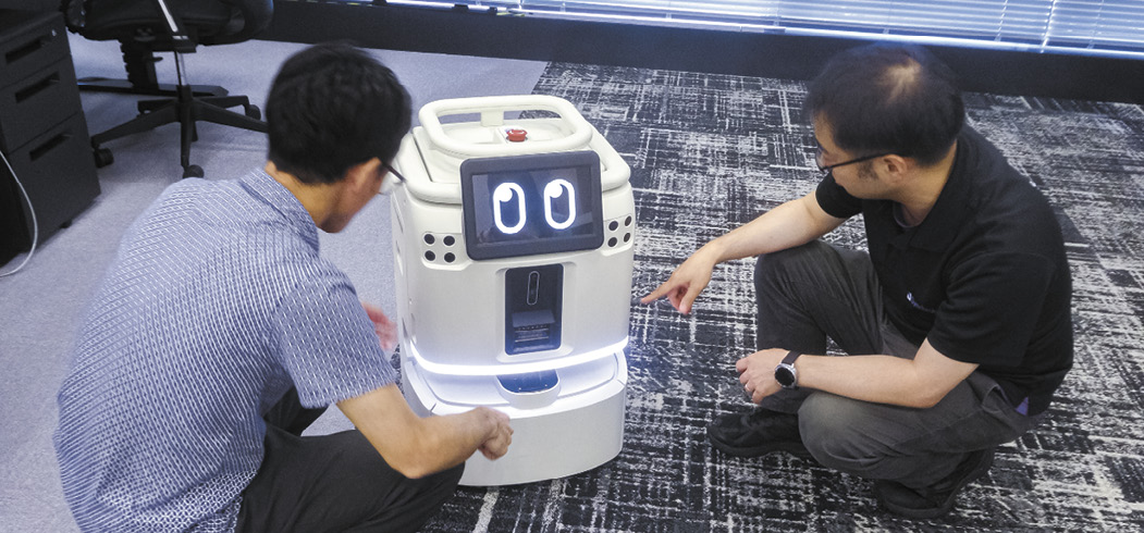 労働力不足の解消に向けて技術力を磨く開発現場の担当者たち